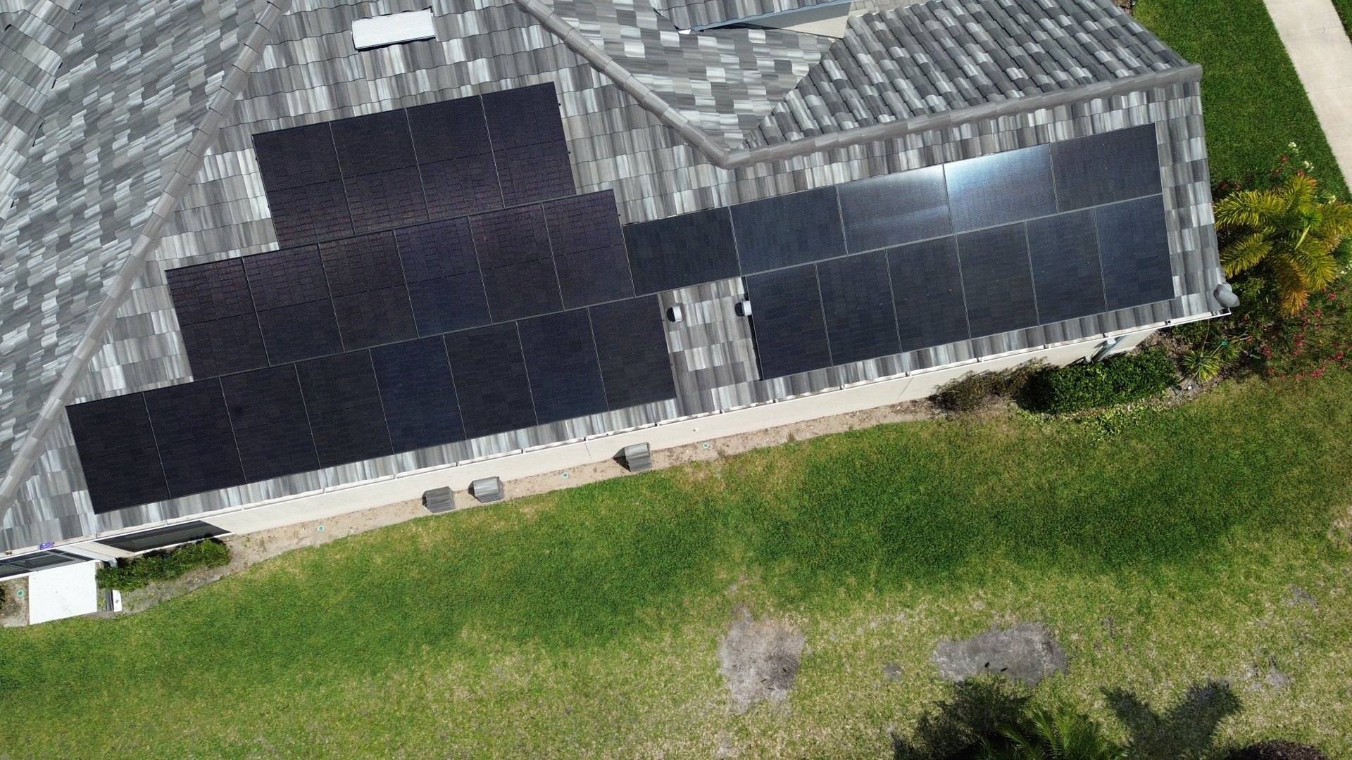 An existing rooftop solar array on a tile roof, from GreenReady’s project photography